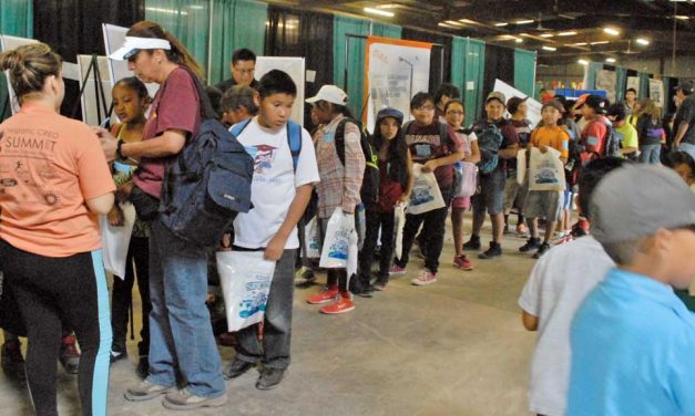 Free backpacks a hit during Kids Day giveaway