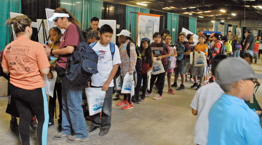 Free backpacks a hit during Kids Day giveaway