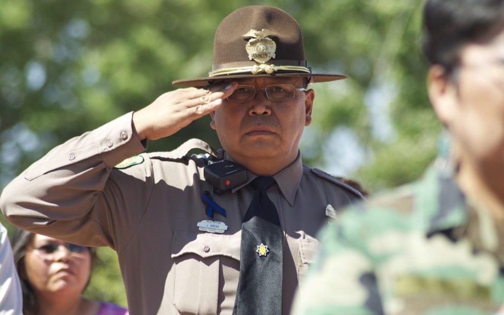 Navajo police officer shot but in stable condition; suspect apprehended