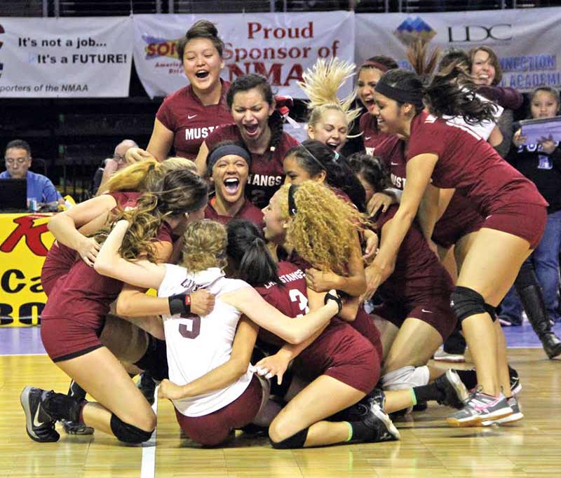  The Ramah volleyball team celebrates after defeating Melrose 3-2 in the New Mexico Class 2A state championship on Nov. 15 at the Santa Ana Star Center in Rio Rancho, N.M. (Times photo – Sunnie R. Clahchischiligi)