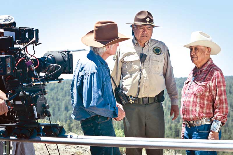 A scene is filmed that includes “Sibley” (Chris Robinson), “Bahe” (James Bilagody) and “Chei” (Thomas H. Begay) for the film “Legends from the Sky.” (Courtesy photo)