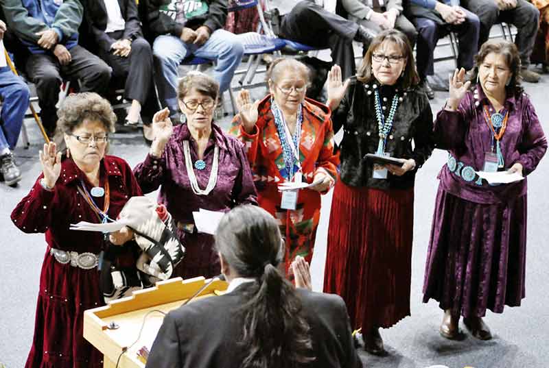 Dolly C. Begay, Dr. Pauline M. Begay, Marlene Burbank, Delores Greyeyes, and Bernadette Todacheene of the Navajo Board of Education stand before Judge Malcolm P. Begay while taking their oath of office during the 23rd Navajo Nation Council Inauguration Ceremony. (Times photo – Ravonelle Yazzie)