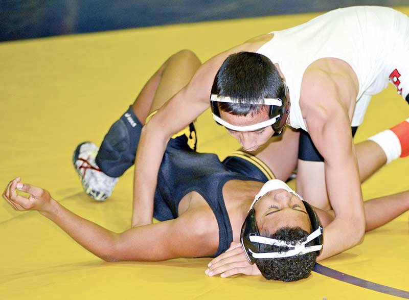  Rodrick Begay of Many Farms (top) pinned five opponents and finished in second place during the 44th annual Joseph City Invitational wrestling tournament in the 120-pound weight class on Saturday. (Times photo – Paul Natonabah)