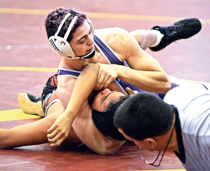 AJ Starkovich (top) is one of four Miyamura wrestlers that is seeing a lot of success on the mat. Starkovich placed second at the prestigious Joe Vivian Classic in Albuquerque last month in the 152-pound weight class. (Times photo – Paul Natonabah)
