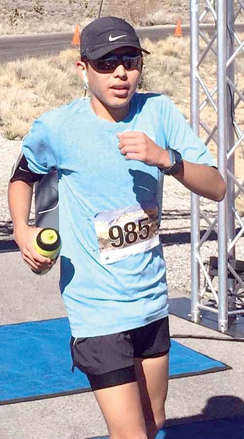 Nakai Lake, 17, finishes the 50,000-meter in 7 hours, 35.29 seconds last year at the Ultra Adventures’ Grand Circle Trails Series in Monument Valley last year. Lake is a Diné youth and got interested in running as a sixth grader. (Courtesy photo)