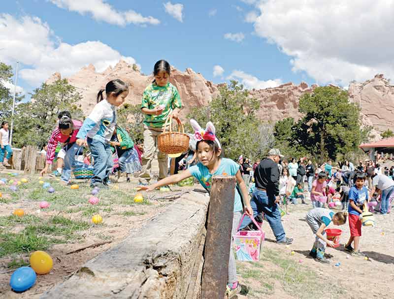 The 5- to 7-year-old age group hurries to pick up eggs during the 2nd annual Easter Eggstravaganza, hosted by the Blue Bird Pinups, on Saturday in Window Rock. (Times photo - Stacy Thacker)