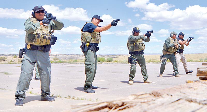 In this August 2014, fallen Navajo police officer Alex Yazzie, left, is seen here training with fellow comrades in Mentmore, N.M. Yazzie, a Marine Corps veteran, was shot and killed in the line of duty on the night of March 19 in Cove-Red Valley, Ariz. (File photo - Donovan Quintero)