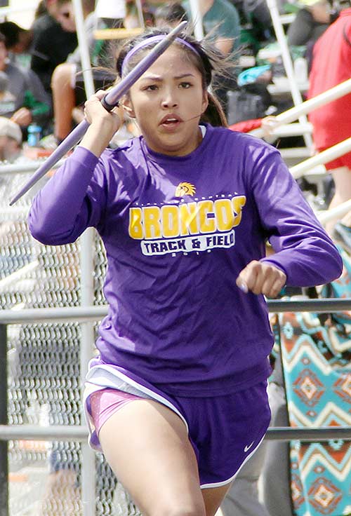 Kirtland Central High School junior Megan Silversmith, who is six inches away from qualifying for next month’s New Mexico Class 4A state track meet, finished in fourth place after throwing 95 feet 8 inches at the Aztec Invitational on April 24. (Times photo – Sunnie R. Clahchischiligi)