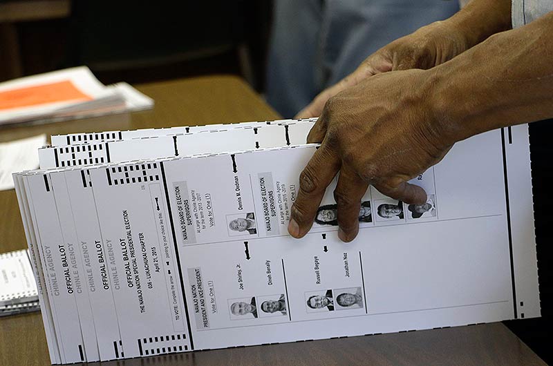 Ballots are recounted in the conference room of the Election Administration Office on Thursday. The recount was prompted by the Shirley administration. (Times photo-Stacy Thacker) 