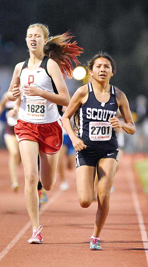 Lady Scout Chamique Duboise, right, races against Jessica Roskelley of Page in the 800-meter race on Saturday in Mesa, Ariz. On May 8, Duboise won the 3200-meter race with a time of 11:16.92.(Times photo – Donovan Quintero)