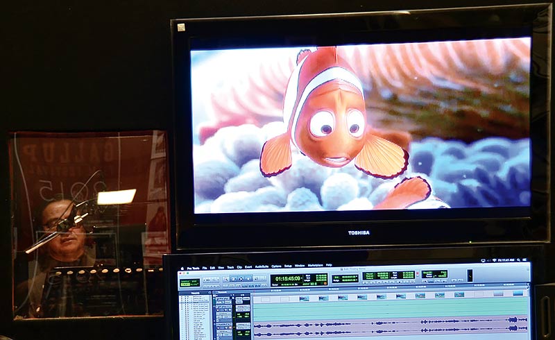 Disney's most famous fish, Nemo, from "Finding Nemo," is shown on a TV screen while an actor records a scene in Navajo. (Courtesy photo)