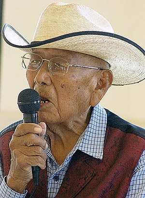 In Navajo, Thomas Walker Sr. talked about the history of the Tsídii To’ii Senior Center on July 23, during its 4th annual celebration in Birdsprings, Ariz. (Times photo – Krista Allen)