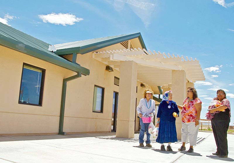 Rose Williams, left, and her mother Hazel Williams, 86, (in blue outfit) chat with two women outside Tsídii To’ii Senior Center on July 23, at the conclusion of the senior center’s 4th annual celebration in Birdsprings, Ariz. (Times photo – Krista Allen)