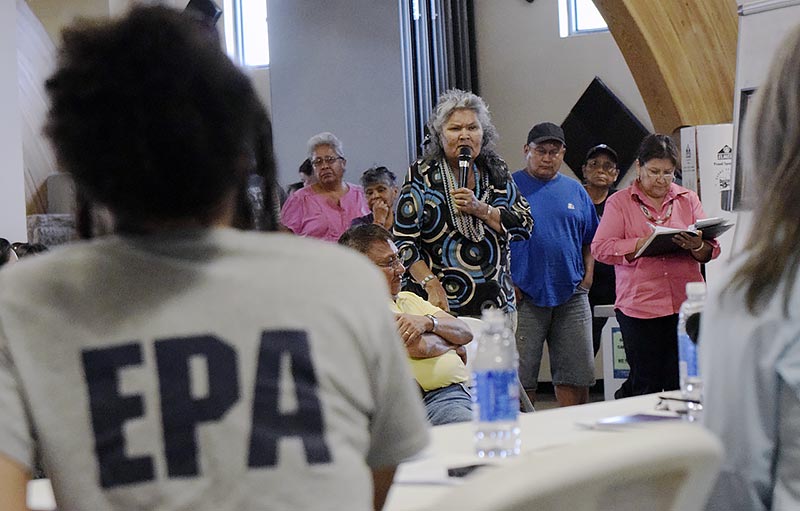 Upper Fruitland farmer Lenora Williams expresses her frustrations to EPA remedial project manager Zi Zi Angelica Searles about the problem the office she represents caused Saturday night during a meeting at the Nenahnezad Chapter. (Times photo - Donovan Quintero)