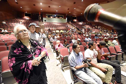 Farmer Barbara Morgan from Shiprock waits her turn to address Navajo Nation President Russell Begaye and key staff members involved in the San Juan River contamination Thursday night in Shiprock, N.M. (Times photo - Donovan Quintero)