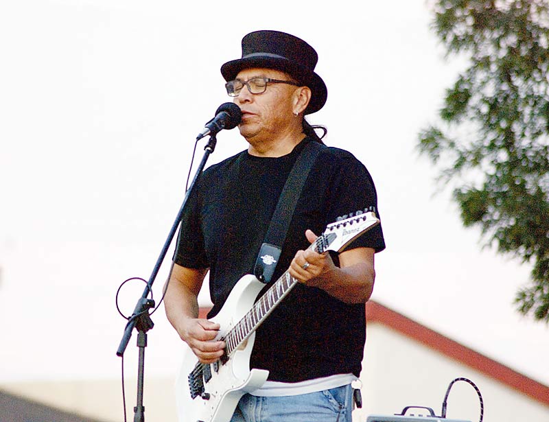 Piñon, Ariz. native Nolan Karras James of the band Skool Boy Kook performed on Aug. 19, during Lake Powell Tourism's Sounds of Summer at the city park in Page, Ariz. James sings and plays Diné blues, a music genre he performs in the English and the Navajo languages. (Times photo – Krista Allen) 