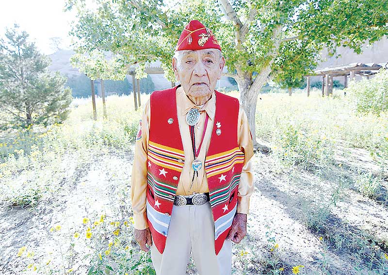 Navajo Code Talker George B. Willie Sr., 88, from Leupp, Ariz., poses for the camera before the start of the parade on Navajo Code Talker in Window Rock. More than 1,500 people honored Willie and his comrades at the Veterans Memorial Park. (Times photo – Donovan Quintero)