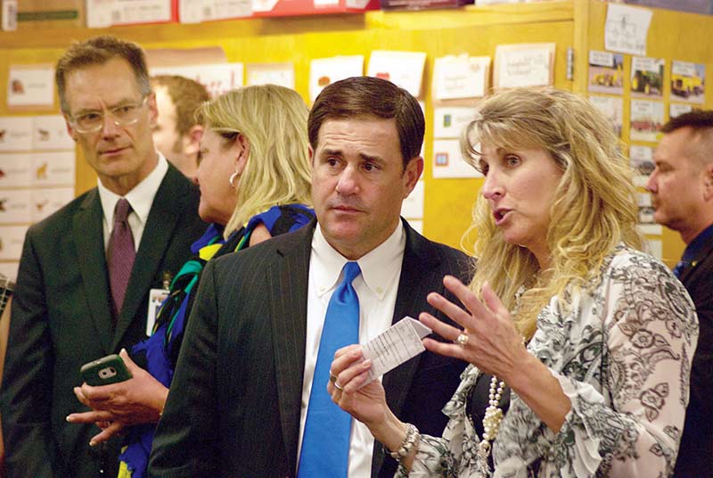 Navajo Times | Krista Allen Puente De Hózho Elementary principal Dawn Trubakoff explains to Arizona Gov. Doug Ducey how the school mirrors the vision of the school: building bridges between cultures and rich languages such as Spanish and Diné bizaad. 