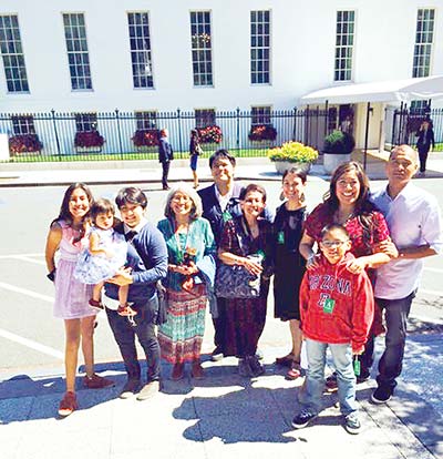 Amanda Tachine, second from right, poses with her husband (far right) and the rest of her family outside the White House after being honored as a "Champion of Change."