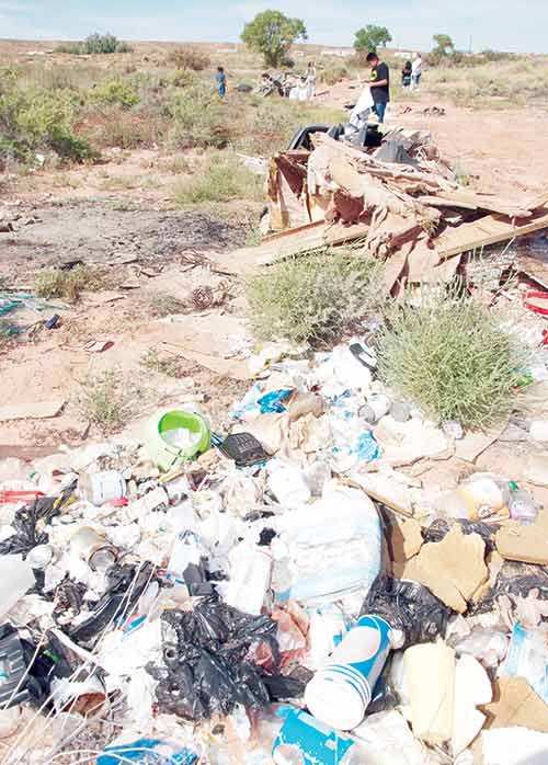 Navajo Times/Krista Allen A group of Tuba City residents tackled this illegal dumpsite last weekend, carting loads of trash to the transfer station. 
