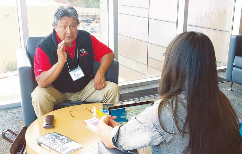 Navajo Times | Stacy Thacker Al Henderson gives advice to an entrepreneur during the Change Labs 2015 event on Friday, Oct. 2 at UNM-Gallup. Henderson acted as a mentor for the event and said that he can help entrepreneurs start with nothing and create a business.