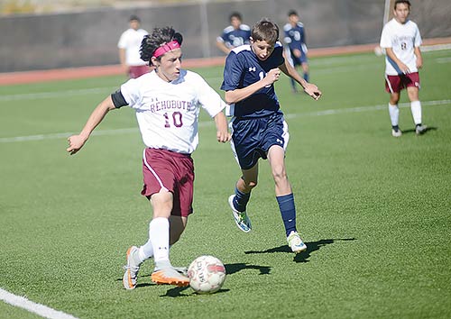 Navajo Times | Paul Natonabah Rehoboth’s Christian Jaqkuez (10) drives past a Ruidoso defender during first round of the New Mexico state soccer playoff at Rehoboth Christian on Oct. 31. The Lynx won 1-0. 