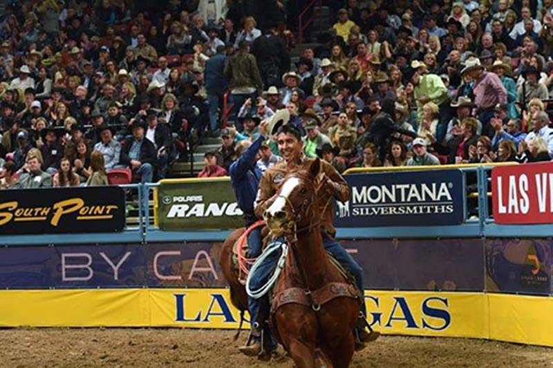Navajo professional team roper Derrick Begay makes his victory lap during the 57 annual Wrangler National Finals Rodeo in Las Vega, Nev. 