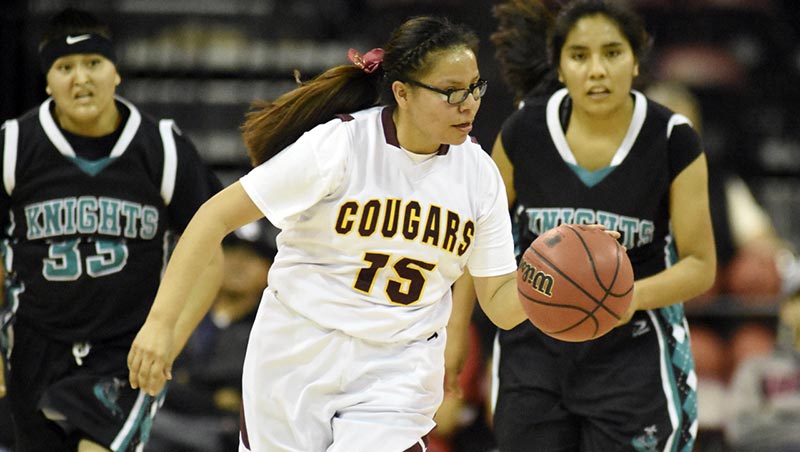 Navajo Times | Donovan Quintero Rock Point Lady Cougar Keandra Sam (15) drives the ball down the court Friday morning in Prescott Valley, Ariz. 