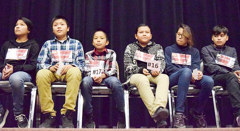 Navajo Times | Krista Allen Spellers, from left to right, include Kristen Natoney, Lornato Begay, Archelaus Yazzie, Kaelea Curley, Mikaela Tallman, and Michael Andresakis wait for the practice round of the sixth-grade competition during the Navajo Times’ Western Navajo Regional Spelling Bee Feb. 11 at the Greyhills Academy High auditorium in Tuba City.