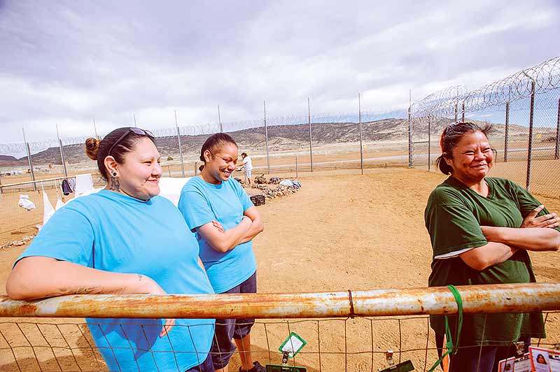 Navajo Times | Adron Gardner Erma Bearshield, 32, left, Ilene Escalanti, 30, and Jennifer Wilson, 36, laugh together when being interviewed at the New Mexico Women's Correctional Facility in Grants Feb. 18.