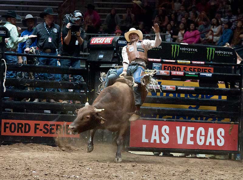 Special to the Times | Ravonelle Yazzie Navajo bull rider Spud Jones of Tohatchi, N.M., leans back on the bull Texicali on Saturday night in Albuquerque, N.M., during the Ty Murray Invitational at the WisePies Arena. 