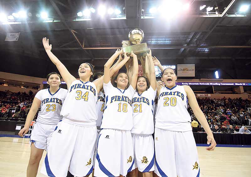 Navajo Times | Donovan Quintero The Valley Sanders Lady Pirates hold their Arizona Division V state championship trophy in the air Saturday after defeating the Rock Point Lady Cougars, 77-40, at the Prescott Valley Events Center in Prescott Valley, Ariz.