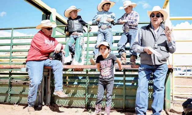 Charley hangs up hat with bull riding school