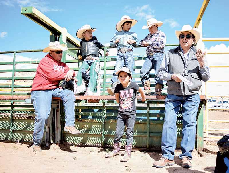 Charley hangs up hat with bull riding school