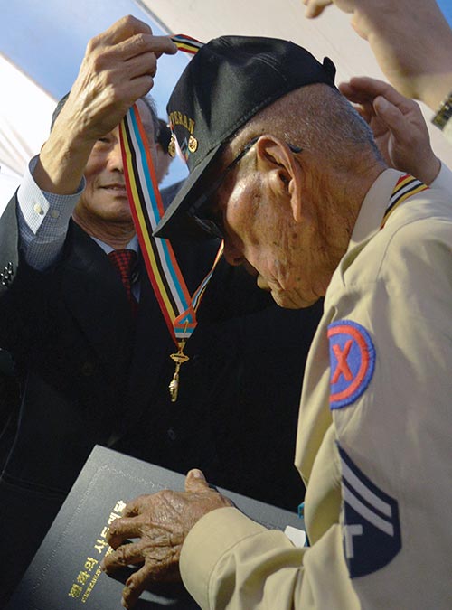 Special to the Times | Ravonelle Yazzie Representatives of South Korea honor Navajo Korean War Veterans with the “Ambassador for Peace Medal” on May 22 in Leupp, Ariz., at the Ranch Hands Ministry Church during the Honoring Korean War Veterans of the Navajo Nation & Navajo-Korean Fellowship Worship Service.