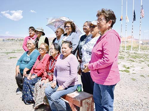 Navajo Times | Krista Allen Blue Star Moms pose for a photo on Memorial Day in Kayenta, where a flag-raising ceremony took place at the Kayenta Veterans Park. The Blue Star Moms say they find comfort at events like this to share their pride, devotion, and worries for their sons and daughters currently serving, or have serve, in the armed forces.