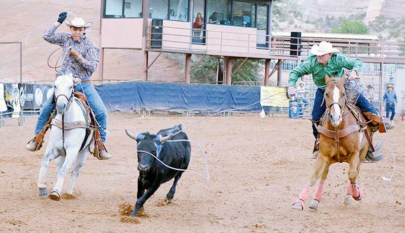Navajo Times | Ravonelle Yazzie Diné cowboy Corey Charley waits his turn to rope as his partner Zant Zamora ropes the steer’s horn on Saturday in Church Rock, N.M. Both ropers finished as the reserve champion in the New Mexico High School Rodeo Association.