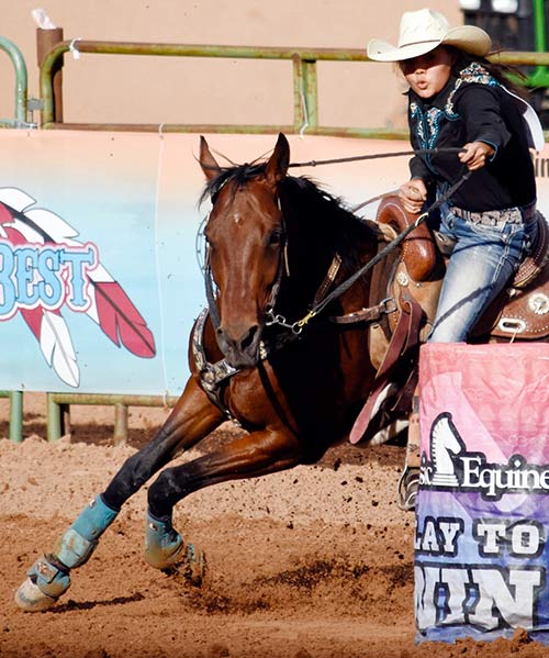 Navajo Times | Ravonelle Yazzie Callie Edgewater of Greasewood, Arizona, makes her way around the barrel with her horse Trinity on Saturday during the Best of the Best Timed Event Rodeo. 