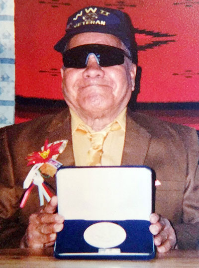 Submitted Navajo Code Talker Peter Bitsie, poses with his Congressional Gold Media. Family members say Bitsie has passed on. He was 92. 