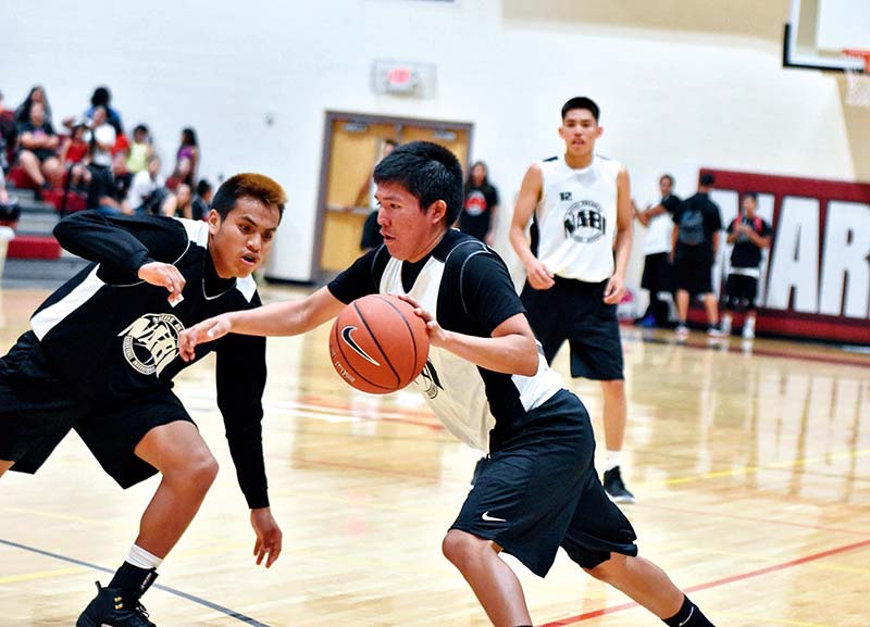 Navajo Times | Ravonelle Yazzie Northern AZ Elite player Delvin Benally (10) drives to the basket on Friday during the Native American Basketball Invitational in Maricopa, Ariz