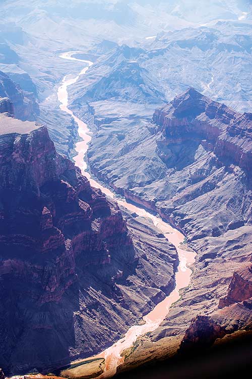 Navajo Times | Adron Gardner The Colorado River, seen from an EcoFlight plane Wednesday, runs muddy near its confluence with the Little Colorado. The site is under consideration for a major tourist development, the Grand Canyon Escalade.