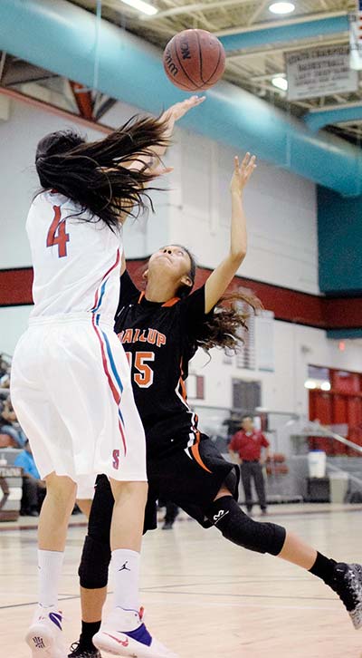 Navajo Times | Donovan Quintero Shiprock Lady Chieftain Cassidy Duncan (4) slaps the ball away from Gallup Lady Bengal Deedra Cadman on Saturday in Shiprock. The Lady Chiefs pulled away from Gallup with a 83-65 win.