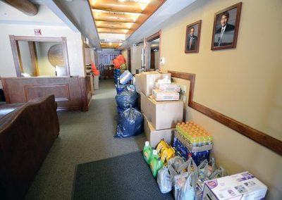 Bags and boxes line the president's office hallway