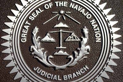 Metallic engraving of Great Seal of Navajo Nation Judicial Branch.