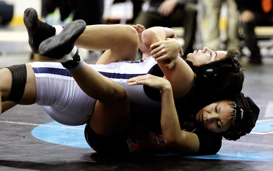 Wrestler overcomes injury, wins state girls’ title