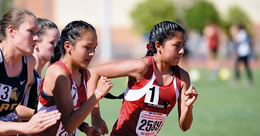 Runners race neck-to-neck.