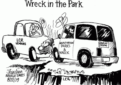 Wreck in the Park: LCR Vendors clash with Navajo Nation Parks and Wreck on cliff overlooking river.
