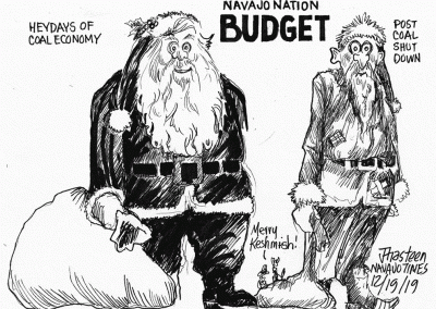 Fat Santa representing Navajo Nation budget during heydays of coal economy. Skinny Santa shown after coal shut-down.