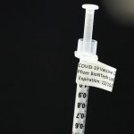 AZ races to vaccinate health workers as infections rise