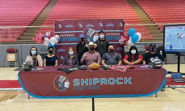 Shiprock football player signs on for college